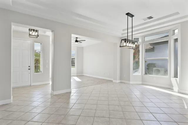 an aerial view of residential houses with outdoor space and street view