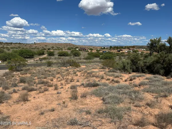 a view of a lake in middle of forest