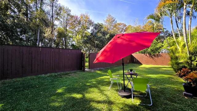 a view of a swimming pool with a outdoor seating