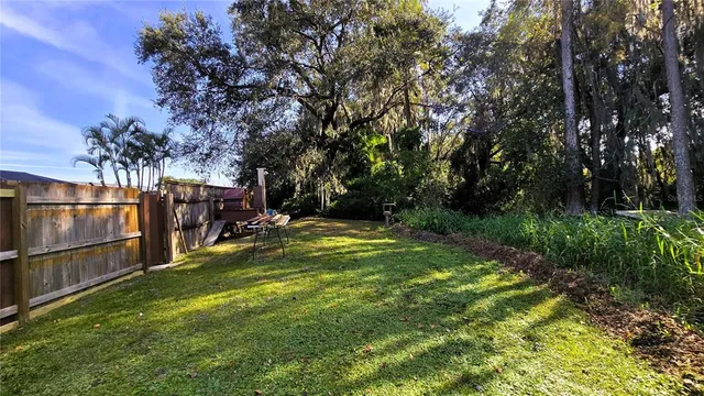 a view of a house with a wooden deck