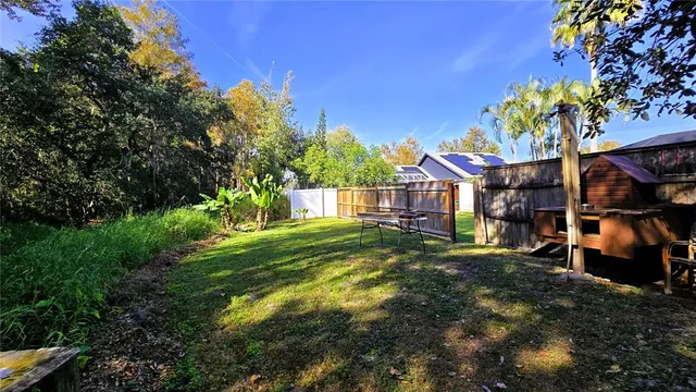 a view of a pathway of a house with a tree