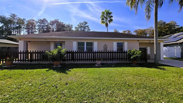 front view of a house with a yard