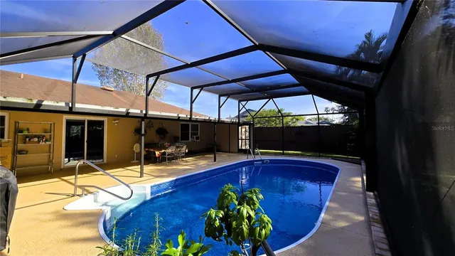 a kitchen with stainless steel appliances granite countertop a refrigerator and cabinets