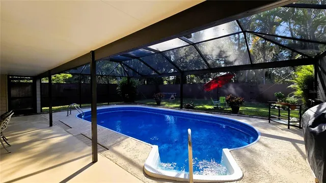 a view of a hallway with wooden shelves