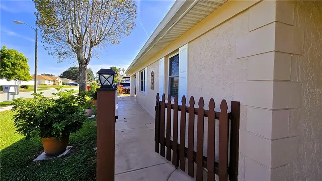a bedroom with a bed and a flat tv screen on a dresser