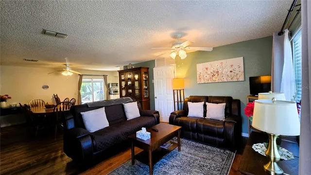 a bathroom with a sink vanity mirror and tub