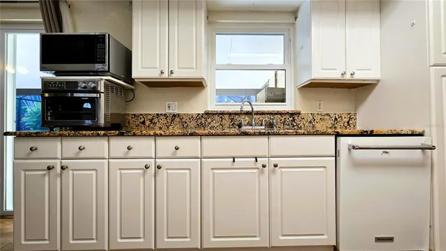 a bathroom with a toilet and a shower curtain