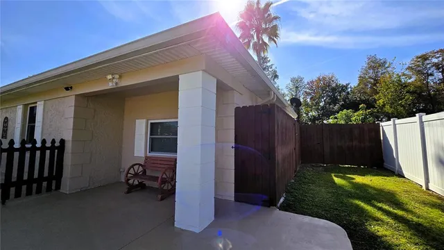 a view of a backyard with a cabin and a chair
