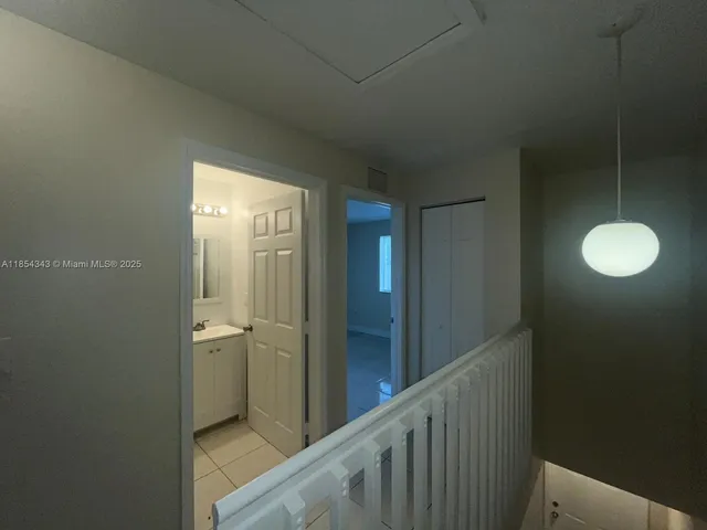 a view of a bathroom from a hallway