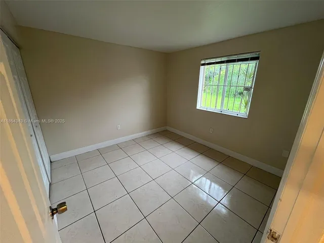 a view of an empty room and window