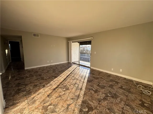 a view of an empty room and window