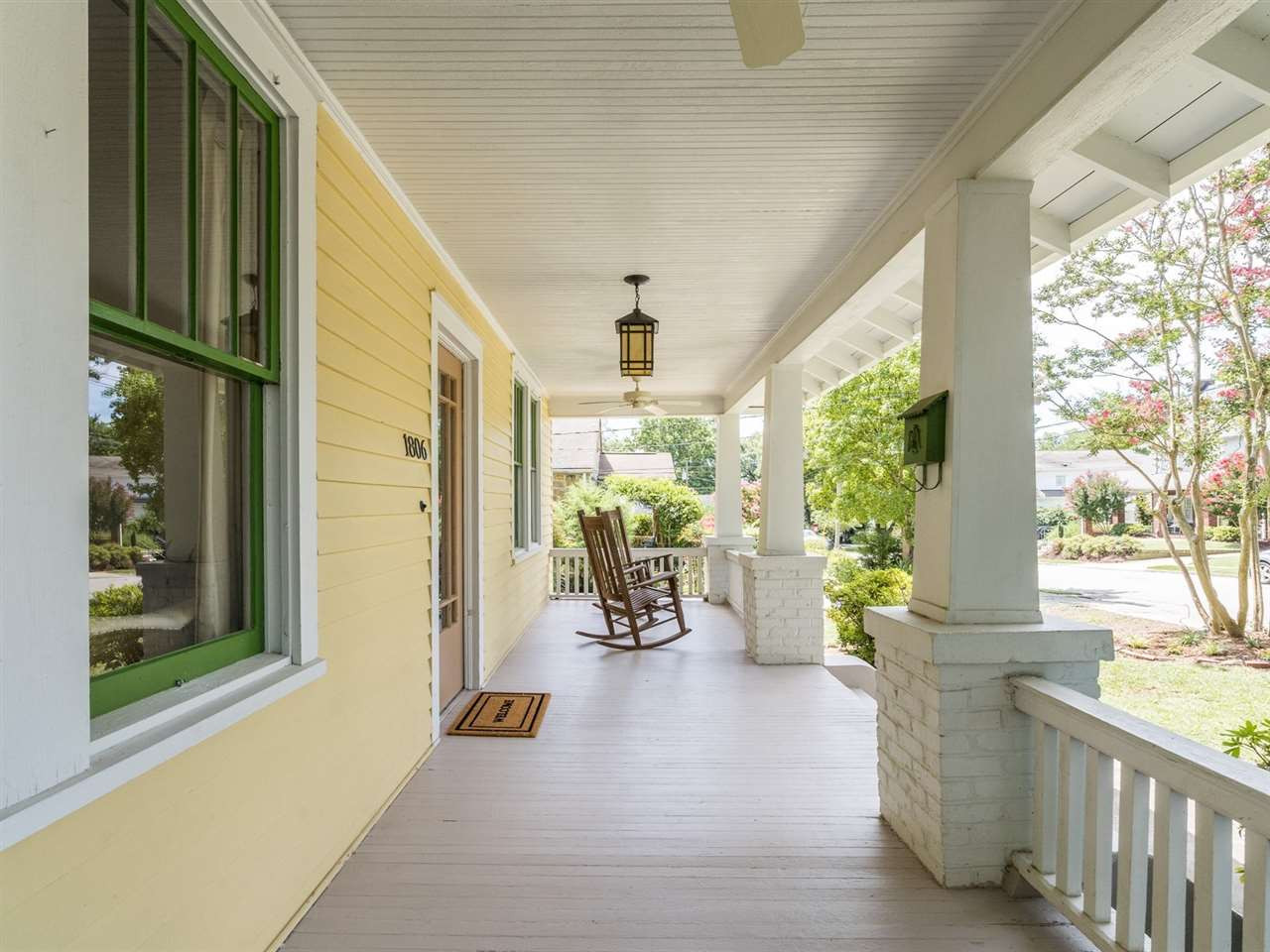 The front porch adds additional charm and character to this lovely home built in the 1920s. Covered Front Porch