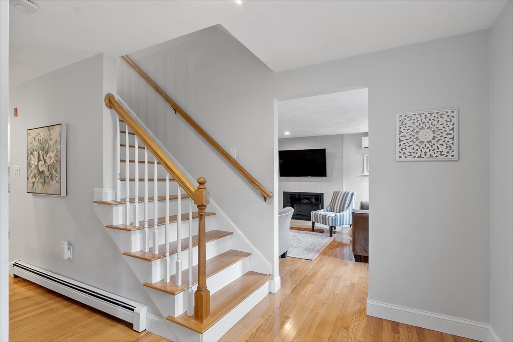 106 Reed Farm Road Boxborough, MA 01719 - Photo 15 of 40 a view of entryway and hall with wooden floor