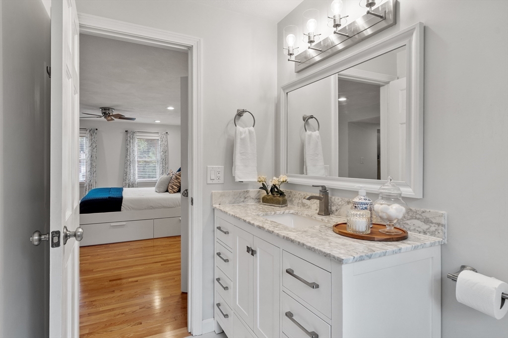 106 Reed Farm Road Boxborough, MA 01719 - Photo 20 of 40 a bathroom with a sink double vanity granite and a mirror