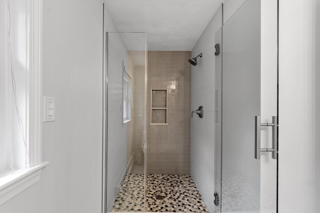 106 Reed Farm Road Boxborough, MA 01719 - Photo 21 of 40 a bathroom with a shower and a toilet