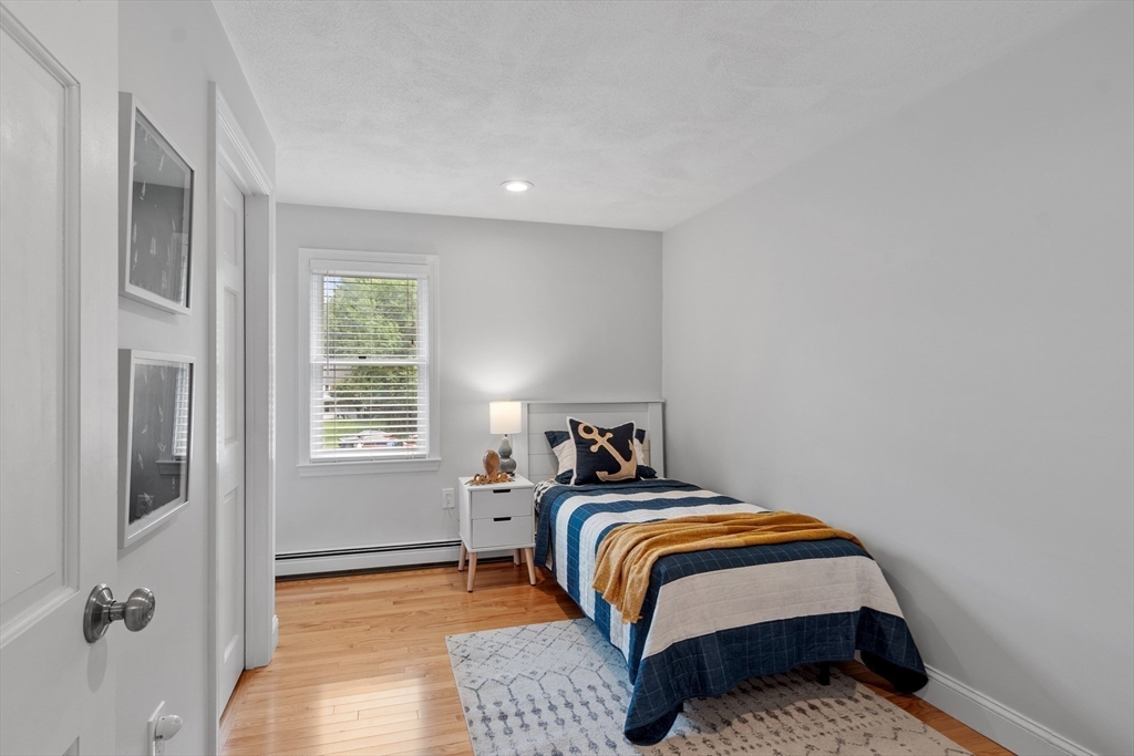 106 Reed Farm Road Boxborough, MA 01719 - Photo 28 of 40 a bedroom with a bed and a window