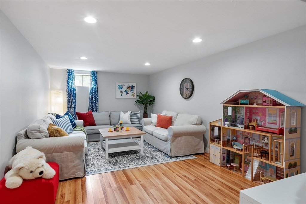 106 Reed Farm Road Boxborough, MA 01719 - Photo 31 of 40 a living room with furniture and a wooden floor