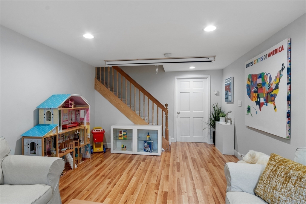 106 Reed Farm Road Boxborough, MA 01719 - Photo 32 of 40 a living room with furniture and a wooden floor