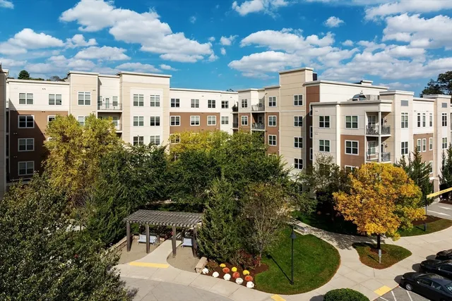 a view of a patio with table and chairs and potted plants