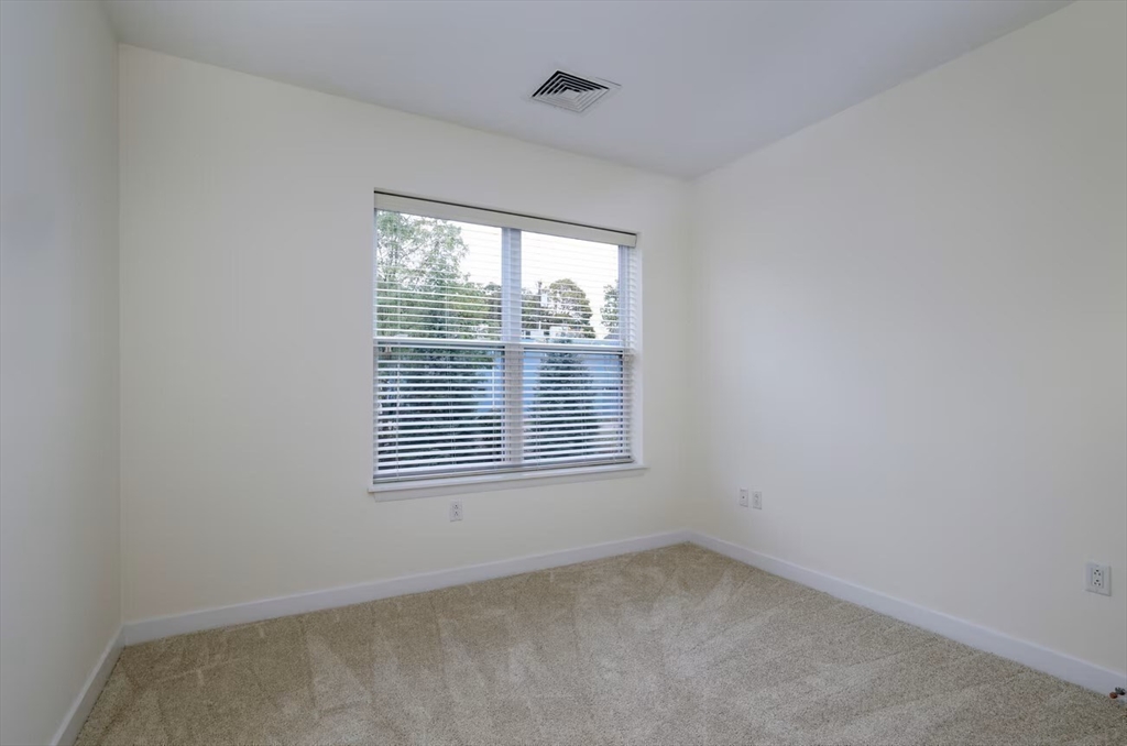 30 Mill Street, Unit 105 Arlington, MA 02476 - Photo 17 of 33 a view of an empty room with a window