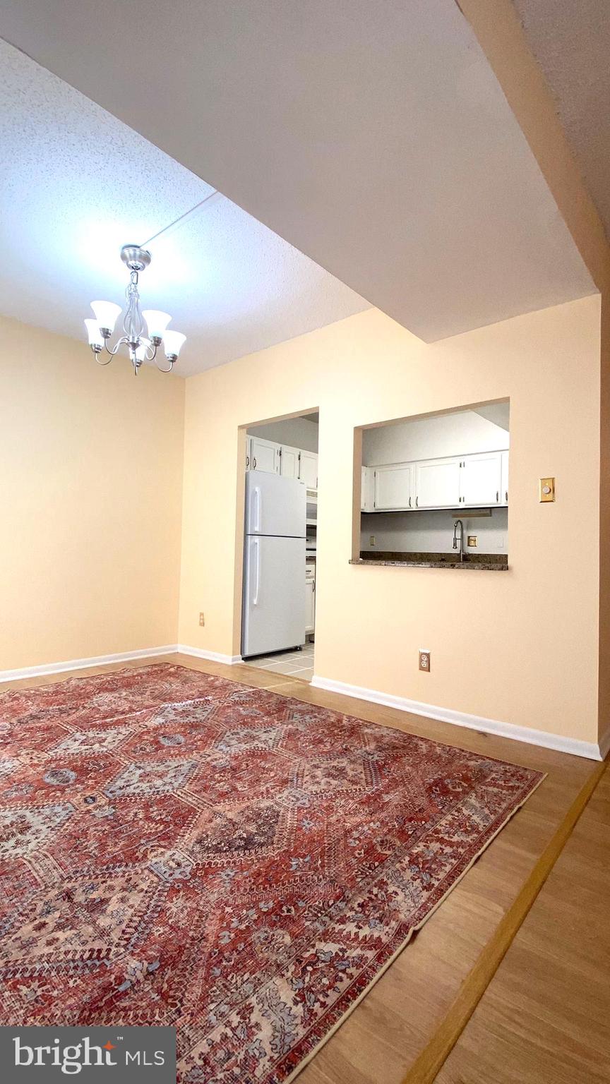 11839 Shire Court, Unit 2C Reston, VA 20191 - Photo 11 of 60 a view of a room with an empty space and a fireplace