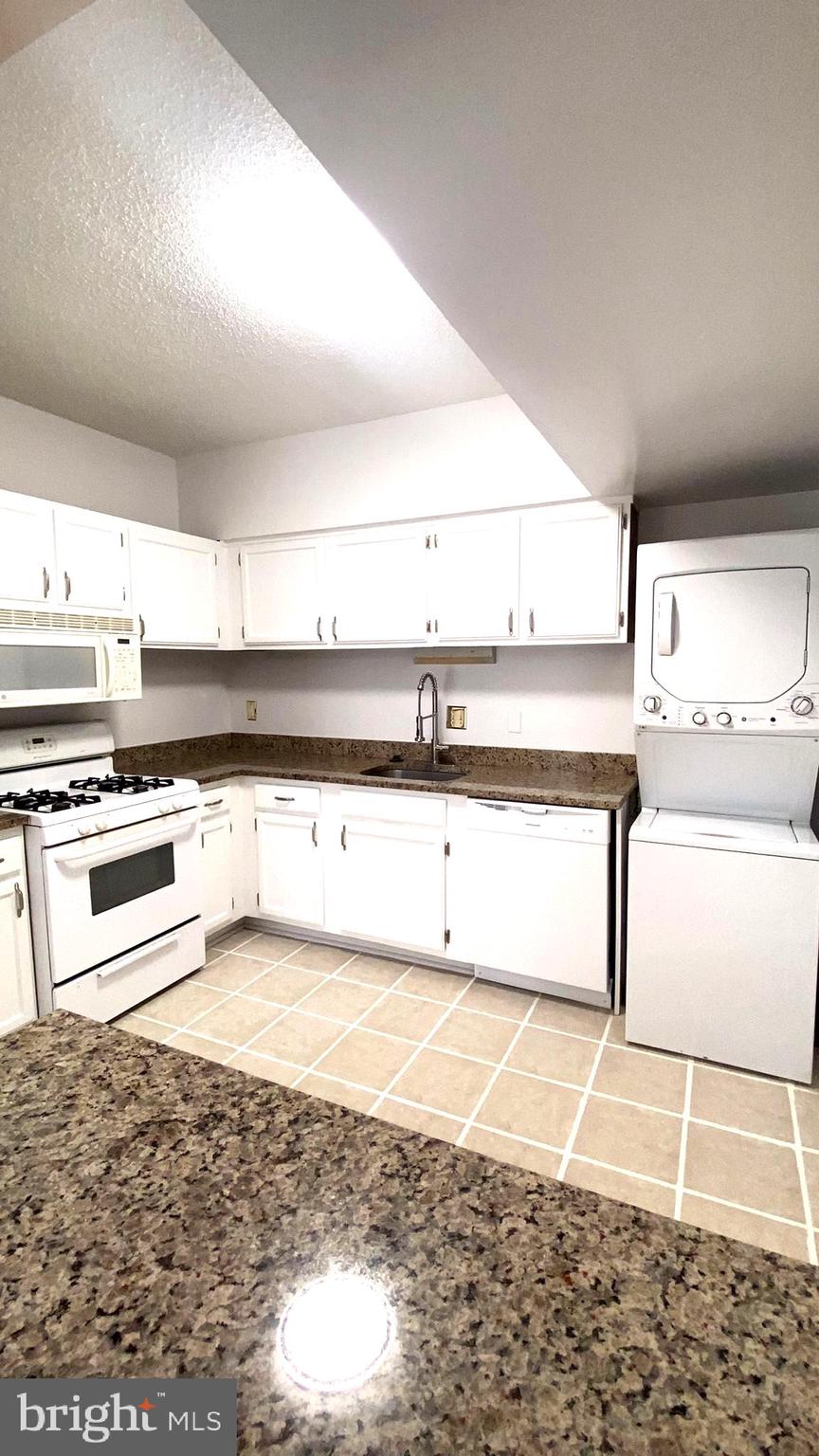 11839 Shire Court, Unit 2C Reston, VA 20191 - Photo 22 of 60 a view of a kitchen with kitchen island and a sink
