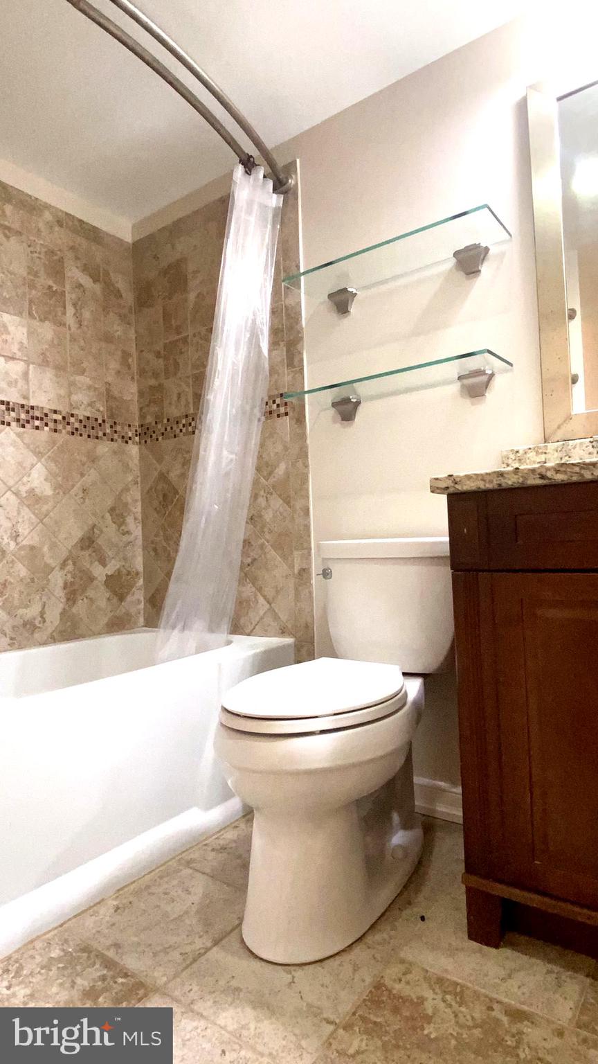 11839 Shire Court, Unit 2C Reston, VA 20191 - Photo 32 of 60 a bathroom with a toilet and a shower