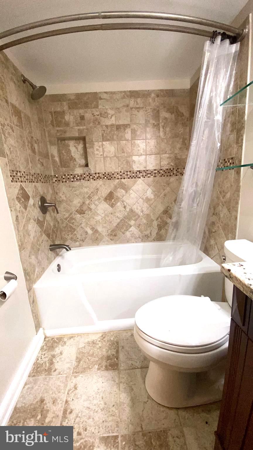 11839 Shire Court, Unit 2C Reston, VA 20191 - Photo 33 of 60 a bathroom with a toilet and a shower