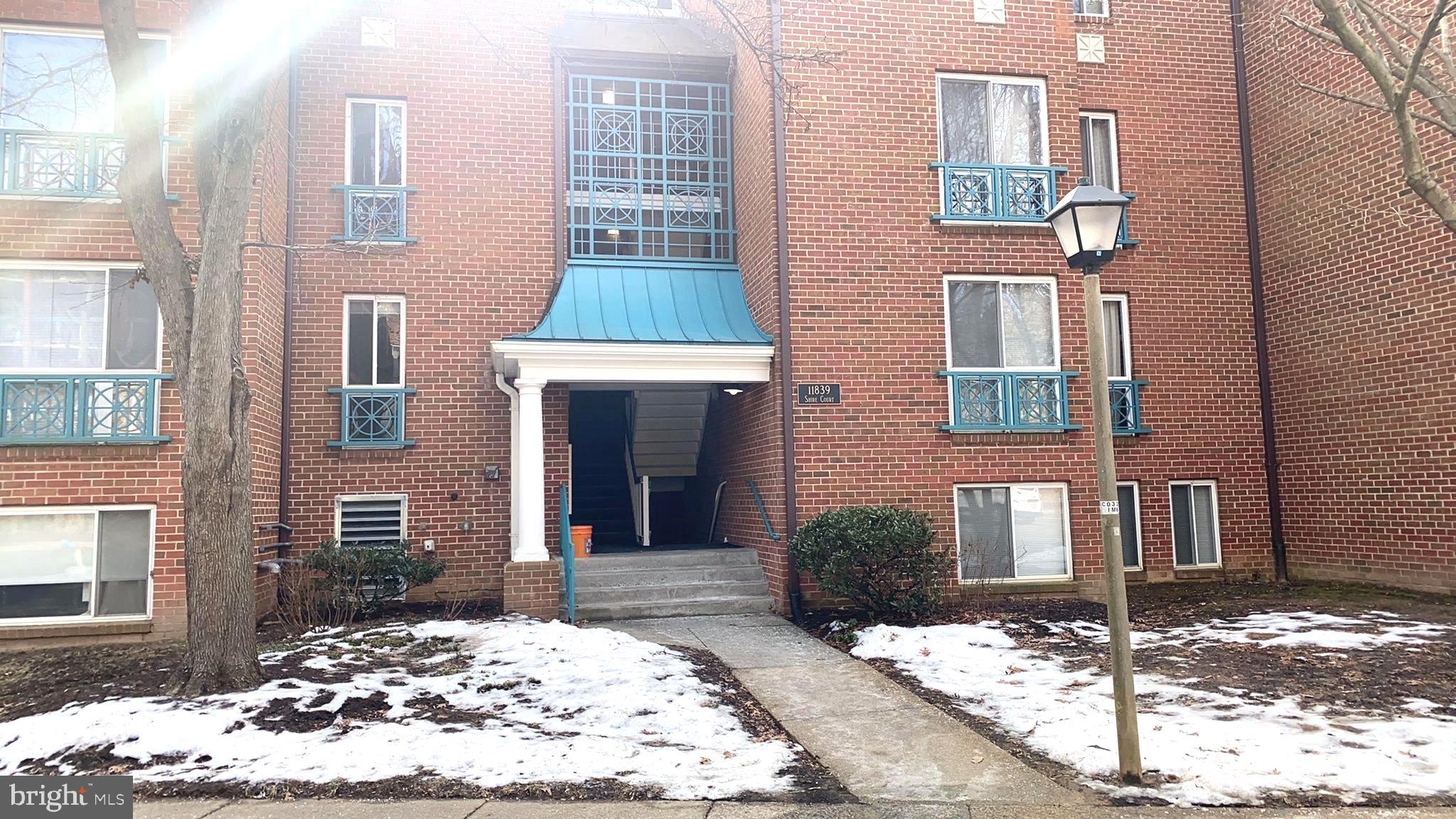 11839 Shire Court, Unit 2C Reston, VA 20191 - Photo 49 of 60 a view of a house with a yard