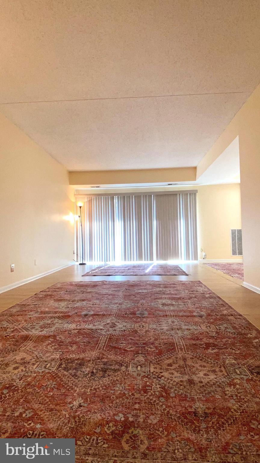 11839 Shire Court, Unit 2C Reston, VA 20191 - Photo 6 of 60 a view of livingroom with hardwood floor
