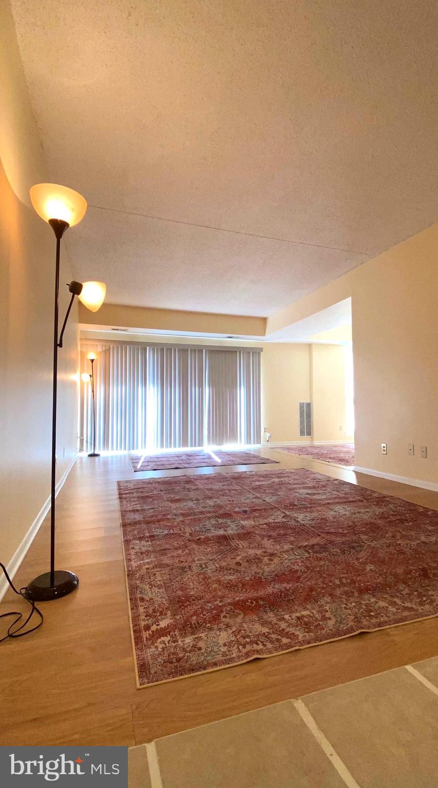 11839 Shire Court, Unit 2C Reston, VA 20191 - Photo 7 of 60 a view of water heater room with wooden floor