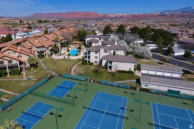 860 Village Road, Unit F7 St. George, UT 84770 - Photo 13 of 18 Aerial perspective of suburban area featuring a mountain backdrop