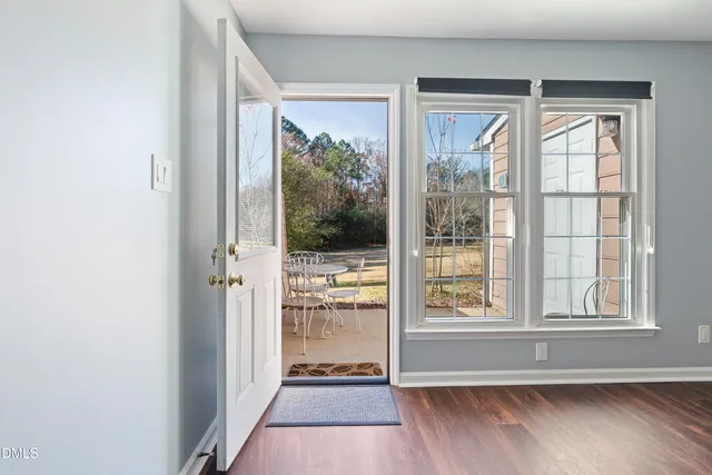 a view of an entryway with wooden floor