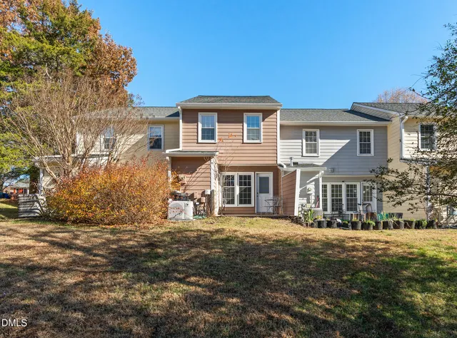 an aerial view of a house with a yard basket ball court and a fountain