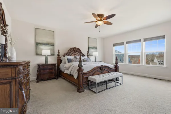 a view of a house with pool and garden