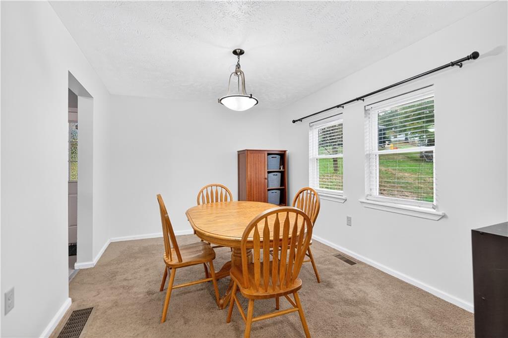 1 6th Avenue Freedom, PA 15042 - Photo 7 of 20 a dining room with furniture a chandelier and window