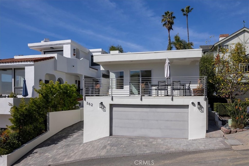 362 Pinecrest Drive Laguna Beach, CA 92651 - Photo 11 of 32 a view of a house with large windows and plants