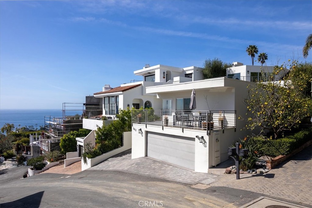 362 Pinecrest Drive Laguna Beach, CA 92651 - Photo 12 of 32 a view of a house with sitting area and potted plants