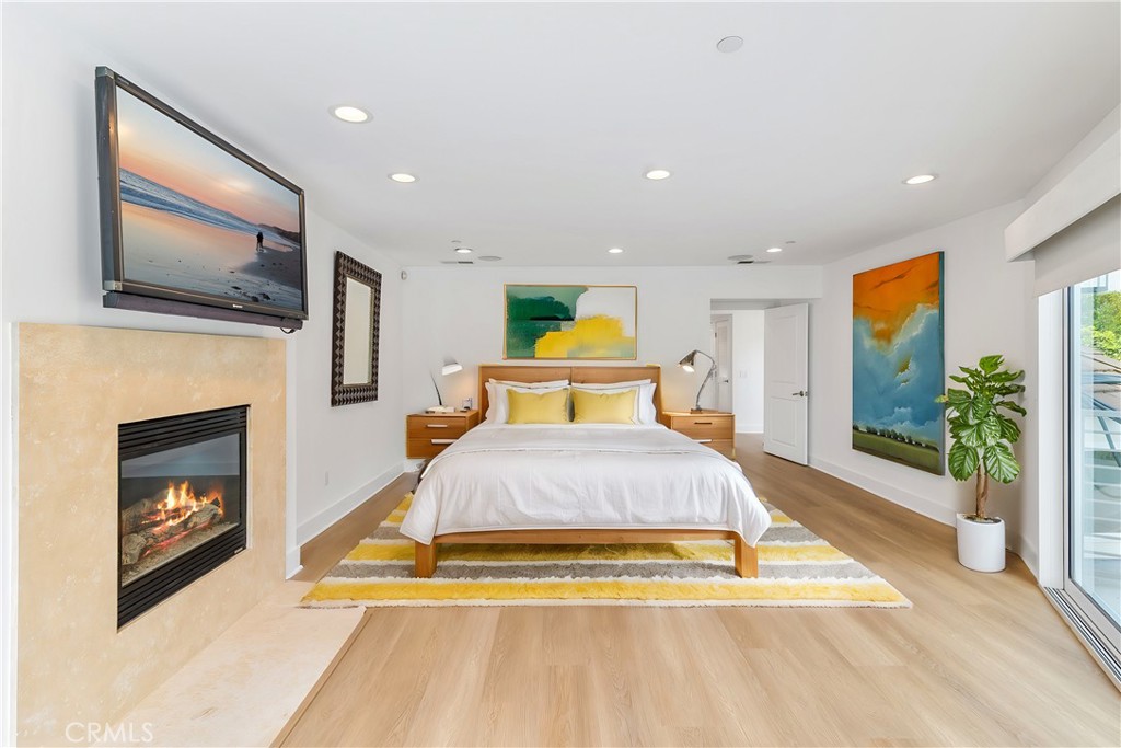 362 Pinecrest Drive Laguna Beach, CA 92651 - Photo 24 of 32 a spacious bedroom with a bed and a flat screen tv