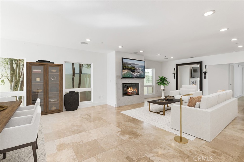 362 Pinecrest Drive Laguna Beach, CA 92651 - Photo 3 of 32 a living room with furniture a fireplace and a flat screen tv