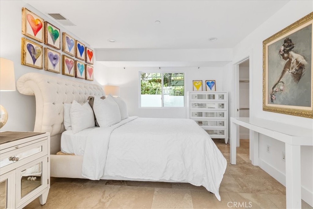 362 Pinecrest Drive Laguna Beach, CA 92651 - Photo 10 of 32 a bedroom with a bed and a book shelf