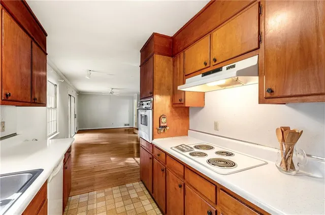 a kitchen with a stove and a sink
