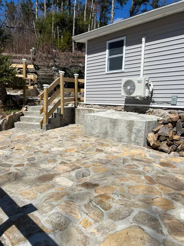 a front view of a house with stairs