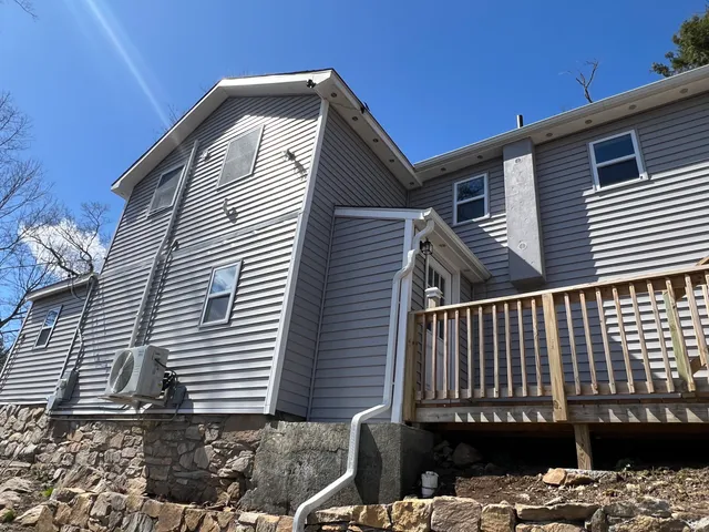 a view of a backyard of the house