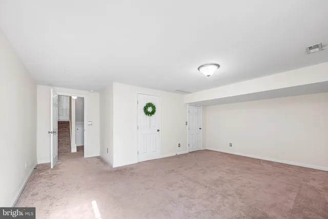 a bathroom with a toilet sink and shower