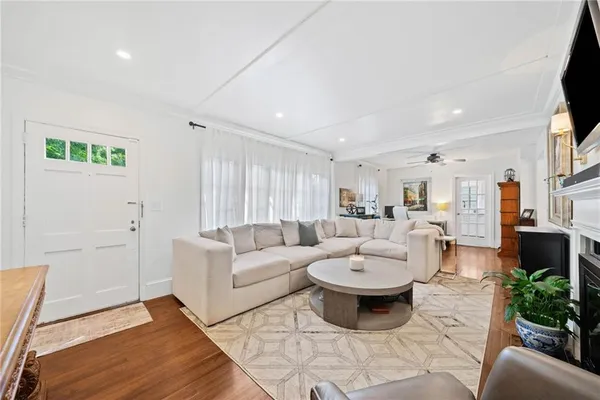 a living room with furniture and a fireplace