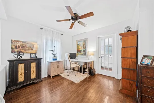 a living room with furniture a fireplace and a window