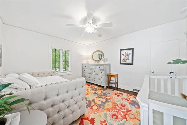 a bedroom with furniture and a table