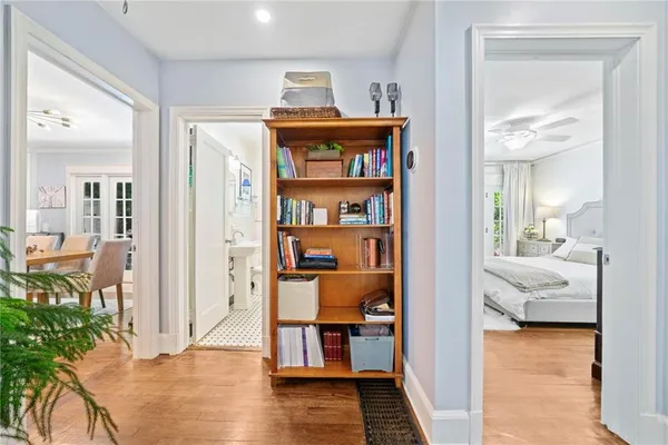 a view of a bedroom with furniture and wooden floor