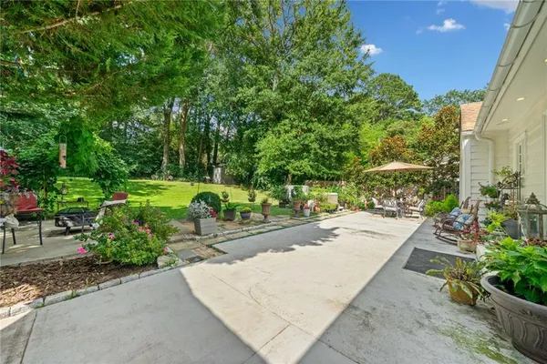 a view of a backyard with sitting area